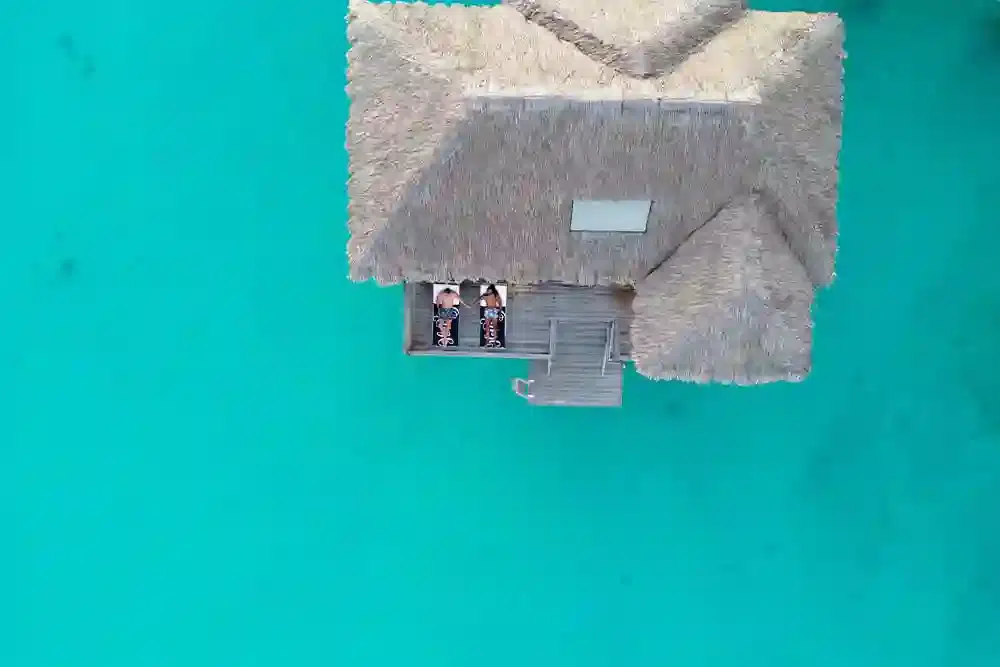 Aerial view of overwater bungalow in Tahiti for LGBT+ travel